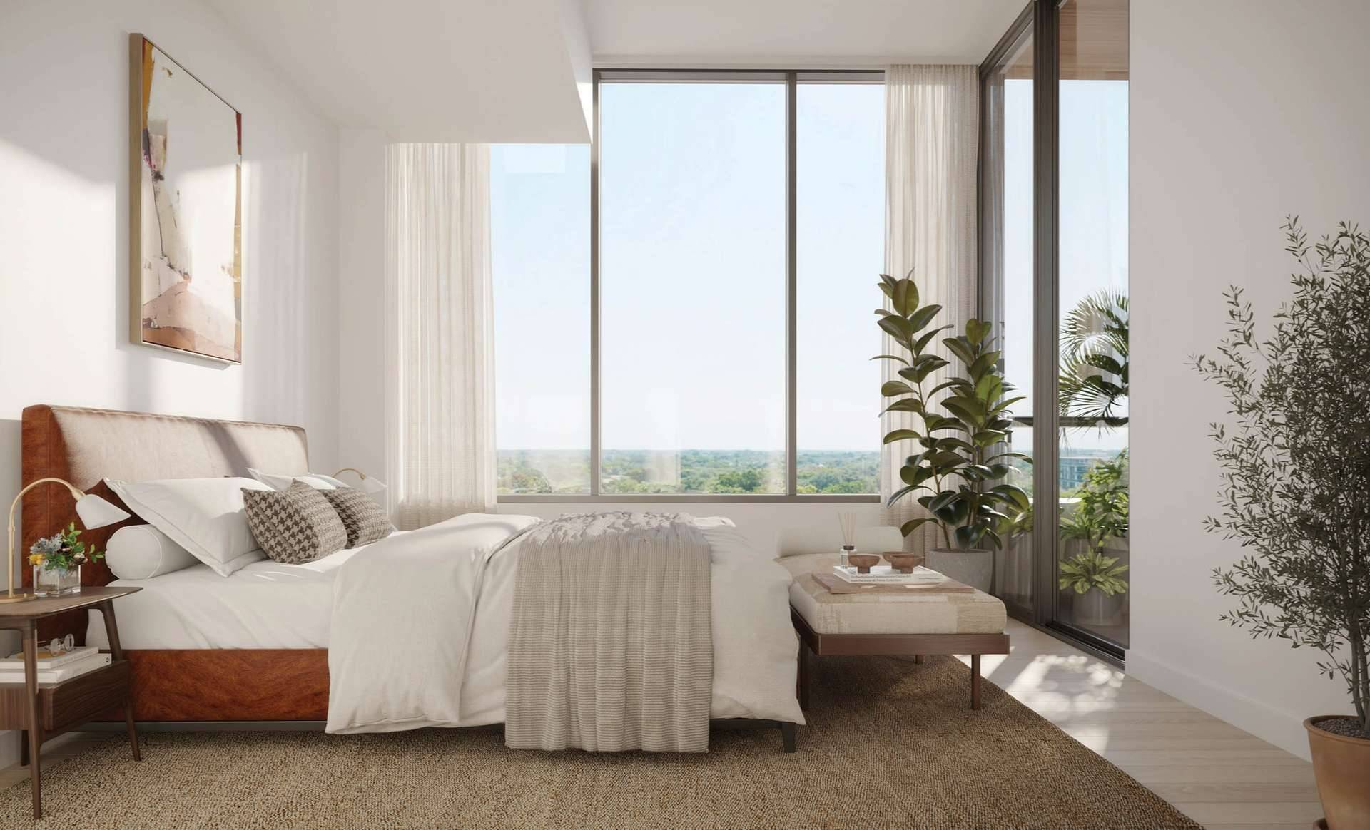 Serene primary bedroom with views and elegant furnishings